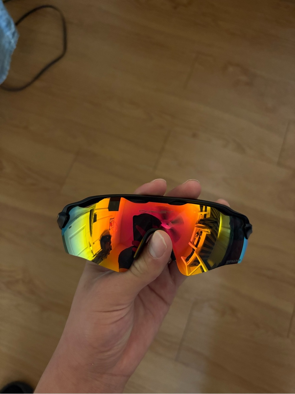Oakley Black Frame Sunglasses with Rainbow Mirrored Lens